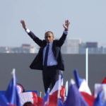 
              FILE- French far-right presidential candidate Eric Zemmour waves to supporters during a campaign rally on the Trocadero square, in front of the Eiffel Tower, Sunday, March 27, 2022 in Paris. Eric Zemmour, 63, a novice politician running under the banner of his newly created party Reconquest!, portrays himself as the new protector of old France with bold proposals on immigration and Islam _ like a Remigration Ministry equipped with airplanes to expedite expulsions of what he says are undesirable migrants. (AP Photo/Michel Euler, File)
            