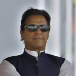 
              FILE - Pakistan's Prime Minister Imran Khan attends a military parade to mark Pakistan National Day, in Islamabad, Pakistan on March 23, 2022. Pakistan’s embattled prime minister faces a tough no-confidence vote Saturday, April 9, 2022, waged by his political opposition, which says it has the numbers to defeat him. (AP Photo/Anjum Naveed, File)
            