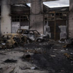 
              Burned cars and warehouses near the Antonov airport in Hostomel, outskirts of Kyiv, Ukraine, Monday, April 4, 2022. (AP Photo/Felipe Dana)
            