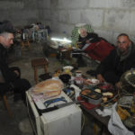 
              People settle in a basement of an apartment building in Kharkiv, Ukraine, Sunday, April 10, 2022. (AP Photo/Andrew Marienko)
            