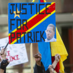 
              Activists rally for Patrick Lyoya in Grand Rapids, Mich., on Tuesday, April 12, 2022. Grand Rapids Police Chief Eric Winstrom said Lyoya, 26, was shot after a struggle with an officer following a traffic stop on April 4. (Cory Morse/The Grand Rapids Press via AP)
            