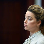 
              Actress Amber Heard appears in the courtroom during a hearing at the Fairfax County Circuit Court in Fairfax, Va., Tuesday April 19, 2022. Actor Johnny Depp sued his ex-wife Heard for libel in Fairfax County Circuit Court after she wrote an op-ed piece in The Washington Post in 2018 referring to herself as a "public figure representing domestic abuse." (Jim Watson/Pool Photo via AP)
            