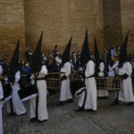 
              Hooded penitents from the ''Exaltacion de La Santa Cruz'' brotherhood play their drums while taking part in a Holy Week procession in Zaragoza, northern Spain, Thursday, April 14, 2022. Hundreds of processions are taking place throughout Spain during the Easter Holy Week after two years off due to the coronavirus pandemic. (AP Photo/Alvaro Barrientos)
            