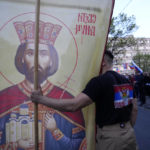 
              A man holds an icon showing Serbian Duke Lazar during a protest against the Serbian authorities for voting to suspend Russia's membership in the UN Human Rights Council in Belgrade, Serbia, Friday, April 15, 2022. Much of the pro-Russia sentiments among Serbs comes from their hatred of NATO; the Western military alliance bombed the country in 1999 to stop a bloody Serb crackdown on ethnic Albanians seeking independence for Kosovo, a Serbian province at the time. (AP Photo/Darko Vojinovic)
            