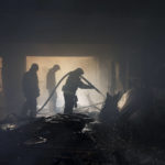 
              Firefighters work to extinguish a fire at a house after a Russian attack in Kharkiv, Ukraine, Monday, April 11, 2022. (AP Photo/Felipe Dana)
            