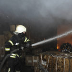 
              A firefighter works to extinguish a fire after shelling in Kharkiv, Ukraine, Wednesday, April 13, 2022. (AP Photo/Andrew Marienko)
            