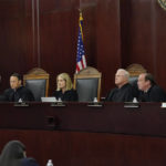 
              FILE - Arizona Supreme Court Justices from left; William G. Montgomery, John R Lopez IV, Vice Chief Justice Ann A. Scott Timmer, Chief Justice Robert M. Brutinel, Clint Bolick and James Beene listen to oral arguments on April 20, 2021, in Phoenix. Arizona victims of long-ago child sex abuse can proceed with lawsuits against groups like the Boy Scouts of America following a recent decision by the state Supreme Court that rejected claims that a 2019 state law extending victims' right to sue was unconstitutional. (AP Photo/Matt York, File)
            