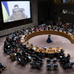 
              Ukrainian President Volodymyr Zelenskyy speaks via remote feed during a meeting of the UN Security Council, Tuesday, April 5, 2022, at United Nations headquarters.  Zelenskyy will address the U.N. Security Council for the first time Tuesday at a meeting that is certain to focus on what appear to be widespread deliberate killings of civilians by Russian troops. (AP Photo/John Minchillo)
            