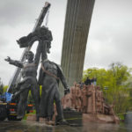 
              A Soviet era monument to a friendship between Ukrainian and Russian nations is seen during its demolition, amid Russia's invasion of Ukraine, in central Kyiv, Ukraine, Tuesday, April 26, 2022. (AP Photo/Efrem Lukatsky)
            