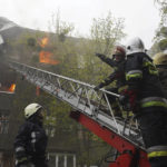 
              Firefighters work to extinguish fire at an apartments building after a Russian attack in Kharkiv, Ukraine, Sunday, April 17, 2022. (AP Photo/Andrew Marienko)
            