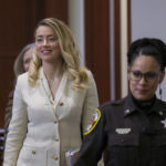 
              Actress Amber Heard arrives in the courtroom at the Fairfax County Circuit Court in Fairfax, Va., Wednesday, April 20, 2022. Actor Johnny Depp sued his ex-wife Amber Heard for libel in Fairfax County Circuit Court after she wrote an op-ed piece in The Washington Post in 2018 referring to herself as a "public figure representing domestic abuse." (Evelyn Hockstein/Pool via AP)
            