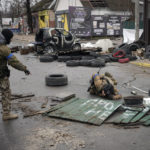 
              Ukrainian servicemen check streets for booby traps in the formerly Russian-occupied Kyiv suburb of Bucha, Ukraine, Saturday, April 2, 2022. As Russian forces pull back from Ukraine's capital region, retreating troops are creating a "catastrophic" situation for civilians by leaving mines around homes, abandoned equipment and "even the bodies of those killed," President Volodymyr Zelenskyy warned Saturday.(AP Photo/Vadim Ghirda)
            