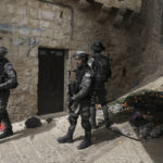 
              Israeli police is deployed in the Old City of Jerusalem, Sunday, April 17, 2022. Israeli police clashed with Palestinians outside Al-Aqsa Mosque after police cleared Palestinians from the sprawling compound to facilitate the routine visit of Jews to the holy site and accused Palestinians of stockpiling stones in anticipation of violence. (AP Photo/Mahmoud Illean)
            