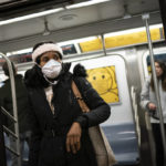 
              Mass transit riders wear masks as they commute in the financial district of lower Manhattan, Tuesday, April 19, 2022, in New York. U.S. District Judge Kathryn Kimball Mizelle in Tampa, Fla., on April 18, 2022, voided the national travel mask mandate as exceeding the authority of U.S. health officials. The mask mandate that covers travel on airplanes and other public transportation was recently extended by President Joe Biden's administration until May 3. (AP Photo/John Minchillo)
            