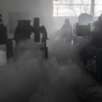 
              Firefighters try to extinguish the fire at a damaged factory following a Russian bombing in Kramatorsk, Ukraine, Thursday, April 14, 2022. (AP Photo/Petros Giannakouris)
            