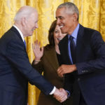 
              Vice President Kamala Harris reacts as President Joe Biden shakes hands with former President Barack Obama after Obama jokingly called Biden vice president in the East Room of the White House in Washington, Tuesday, April 5, 2022. (AP Photo/Carolyn Kaster)
            