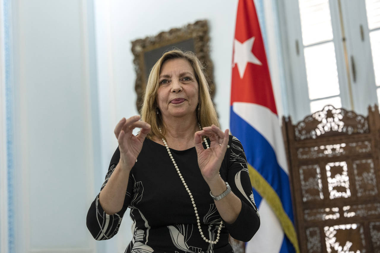 Cuba's Vice minister of foreign relations Josefina Vidal, asks for a face mask after an interview i...