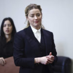 
              Actor Amber Heard arrives in the courtroom at the Fairfax County Circuit Court in Fairfax, Va., Thursday, April 21, 2022. Actor Johnny Depp sued his ex-wife Amber Heard for libel in Fairfax County Circuit Court after she wrote an op-ed piece in The Washington Post in 2018 referring to herself as a "public figure representing domestic abuse." (Jim Lo Scalzo/Pool Photo via AP)
            