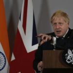 
              British Prime Minister Boris Johnson addresses a press conference in New Delhi, Friday, April 22, 2022.  Johnson told reporters that India had come out strongly against the killings in Bucha earlier this month. The British prime minister also said "he (Indian Prime Minister Narendra Modi) has already intervened several times with Vladimir Putin to ask him what on Earth he is doing and where it is going." (AP Photo/Manish Swarup)
            