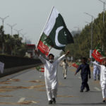 
              Supporters of ruling party Pakistan Tehreek-e-Insaf (PTI) chant slogans during a protest in Islamabad, Pakistan, Sunday, April 3, 2022. Pakistan's embattled Prime Minister Imran Khan said Sunday he will seek early elections after sidestepping a no-confidence challenge and alleging that a conspiracy to topple his government had failed. (AP Photo/Rahmat Gul)
            