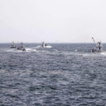 
              Fishing boats head to search for a missing tour boat off a port in Shari, in the northern island of Hokkaido Sunday, April 24, 2022. The Japanese Coast Guard said Sunday that rescue helicopters found four of the 26 people on a tour boat missing in the frigid waters of northern Japan since the day before, but their conditions are unknown. (Kyodo News via AP)
            