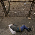 
              The lifeless body of a man with his hands tied behind his back lies on the ground in Bucha, Ukraine, Sunday, April 3, 2022. Associated Press journalists in Bucha, a small city northwest of Kyiv, saw the bodies of at least nine people in civilian clothes who appeared to have been killed at close range. At least two had their hands tied behind their backs. (AP Photo/Vadim Ghirda)
            