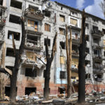 
              A view of a block of apartments buildings damaged by shelling in Kramatorsk, Ukraine, Friday, April 15, 2022. (AP Photo/Andriy Andriyenko)
            