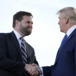 
              Senate candidate JD Vance, left, greets former President Donald Trump at a rally at the Delaware County Fairgrounds, Saturday, April 23, 2022, in Delaware, Ohio, to endorse Republican candidates ahead of the Ohio primary on May 3. (AP Photo/Joe Maiorana)
            