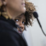 
              Kaliyah Lesure, 9, and her mother, Kandice, speak out for Patrick Lyoya at Grand Rapids City Hall on Tuesday, April 12, 2022, in Grand Rapids, Mich. Grand Rapids Police Chief Eric Winstrom said Lyoya, 26, was shot after a struggle with an officer following a traffic stop on April 4. (Cory Morse/The Grand Rapids Press via AP)
            