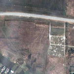 
              FILE - This satellite image provided by Maxar Technologies on Thursday, April 21, 2022 shows an overview of the cemetery in Manhush, some 20 kilometers west of Mariupol, Ukraine, on April 3, 2022. The graves are aligned in four sections of linear rows (measuring approximately 85 meters per section) and contain more than 200 graves. (Satellite image ©2022 Maxar Technologies via AP)
            