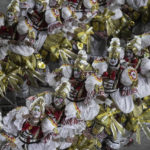 Performers from the Imperatriz Leopoldinense samba school parade during Carnival celebrations at the Sambadrome in Rio de Janeiro, Brazil, Friday, April 22, 2022. (AP Photo/Bruna Prado)