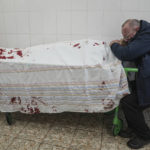 
              FILE - Serhii, father of teenager Iliya, cries on his son's lifeless body lying on a stretcher at a maternity hospital converted into a medical ward in Mariupol, Ukraine, March 2, 2022. A bipartisan group of U.S. lawmakers is calling on the Biden administration to establish field hospitals near Ukraine's border and ramp up medical support for what's expected to be a months-long war of attrition waged by Russia(AP Photo/Evgeniy Maloletka, File)
            