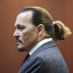 
              Actor Johnny Depp arrives in the courtroom at the Fairfax County Circuit Court in Fairfax, Va., Thursday, April 28, 2022. Actor Johnny Depp sued his ex-wife actor Amber Heard for libel in Fairfax County Circuit Court after she wrote an op-ed piece in The Washington Post in 2018 referring to herself as a "public figure representing domestic abuse." (Michael Reynolds/Pool Photo via AP)
            