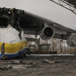 
              FILE - A Ukrainian serviceman walks by the Antonov An-225 Mriya aircraft destroyed during fighting between Russian and Ukrainian forces on the Antonov airport in Hostomel, Ukraine, April 2, 2022. Kyiv was a Russian defeat for the ages. It started poorly for the invaders and went downhill from there.  (AP Photo/Vadim Ghirda, File)
            