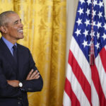 
              Former President Barack Obama listens as Vice President Kamala Harris speaks about the Affordable Care Act, in the East Room of the White House in Washington, Tuesday, April 5, 2022. (AP Photo/Carolyn Kaster)
            