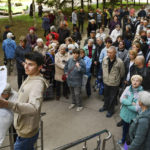 
              People wait in a queue to receive humanitarian aid in Kramatorsk, Ukraine, Tuesday, April 26, 2022. (AP Photo/Andriy Andriyenko)
            