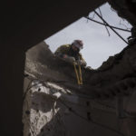 
              Firefighters work to secure a residential building previously damaged by a Russian attack in Kharkiv, Ukraine, Saturday, April 9, 2022. (AP Photo/Felipe Dana)
            