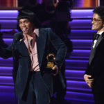 
              Anderson .Paak, left, and Bruno Mars of Silk Sonic accept the award for record of the year for "Leave the Door Open" at the 64th Annual Grammy Awards on Sunday, April 3, 2022, in Las Vegas. (AP Photo/Chris Pizzello)
            