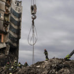 
              Firefighters work on a destroyed apartment building in the town of Borodyanka, Ukraine, on Saturday, April 9, 2022. Russian troops occupied the town of Borodyanka for weeks. Several apartment buildings were destroyed during fighting between the Russian troops and the Ukrainian forces in the town around 40 miles northwest of Kiev. (AP Photo/Petros Giannakouris)
            