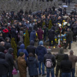 
              Family and friends attend the funeral of 37-year-old sergeant Kostiv Andrew, who was killed in action, at the Lychakiv cemetery, in Lviv, western Ukraine, Tuesday, April 5, 2022. (AP Photo/Nariman El-Mofty)
            