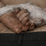 
              A lifeless body of a man with his hands tied behind his back lies on the ground in Bucha, Ukraine, Sunday, April 3, 2022. Associated Press journalists in Bucha, a small city northwest of Kyiv, saw the bodies of at least nine people in civilian clothes who appeared to have been killed at close range. At least two had their hands tied behind their backs. (AP Photo/Vadim Ghirda)
            