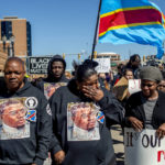 
              Peter and Dorcas Lyoya, parents of Patrick Lyoya, march with their family and supporters wearing all black on Thursday, April 21, 2022 for a rally at the Capitol in Lansing, Mich. to demand justice in the police shooting that took the life of Patrick Lyoya, a Congolese immigrant. (Jake May/The Flint Journal via AP)
            