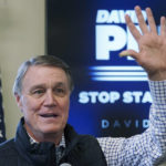 
              FILE - Republican candidate for Georgia Governor former Sen. David Perdue speaks at a campaign stop at the Covington airport, Feb. 2, 2022, in Covington, Ga. Gov. Kemp and Perdue will meet Sunday, April 24, 2022 for the first of three scheduled debates over the next eight days. The debates come as time grows short to persuade the many Georgia voters who will cast ballots ahead of election day May 24. (AP Photo/John Bazemore, file)
            