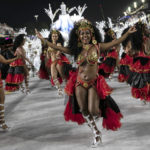 
              A performer from the Salgueiro samba school parades during Carnival celebrations at the Sambadrome in Rio de Janeiro, Brazil, early Saturday, April 23, 2022. (AP Photo/Bruna Prado)
            