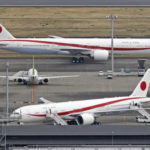 
              This areal photo shows a government aircraft, top, transporting Ukrainian refugees, arrives at the Haneda Airport Tuesday, April 5, 2022, in Tokyo. Japanese Foreign Minister Yoshimasa Hayashi flew back with 20 refugees as Tokyo seeks to play a greater role in the international support for Ukraine. (Kyodo News via AP)
            