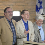 
              Michael Finfer, right, president of Congregation Beth Israel, laughs with Rabbi Charlie Cytron-Walker, center, and Jeff Cohen while speaking to reporters at the synagogue in Colleyville, Texas, Thursday, April 7, 2022. Three months after an armed captor took the three men hostage at the synagogue, the house of worship is reopening. (AP Photo/LM Otero)
            