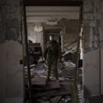 
              Azov battalion Kraken unit commander Konstantin Nemichev poses for photo inside the regional administration building, heavily damaged after a Russian attack last month, in Kharkiv, Ukraine, Thursday, April 21, 2022. (AP Photo/Felipe Dana)
            