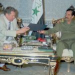 
              FILE - Russian nationalist Liberal Democratic Party leader Vladimir Zirinovski, left, presents a gift to Iraqi President Saddam Hussein, at Hussein's residency in central Baghdad, Oct. 15, 1995 with the Iraqi flag behind. On Wednesday, April 6, 2022 State Duma speaker Vyacheslav Volodin said that Zhirinovsky, who has been the head of Russia's nationalist Liberal Democratic Party for three decades, died at the age of 75. (AP Photo/Pool/File)
            