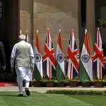 
              Britain's Prime Minister Boris Johnson, left, and his Indian counterpart Narendra Modi walk before their meeting at Hyderabad House in New Delhi Friday, April 22, 2022. (Ben Stansall/Pool Photo via AP)
            