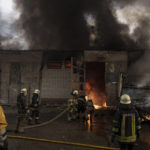 
              Firefighters battle a fire at a warehouse after a Russian bombardment in Kharkiv, Ukraine, Thursday, April 21, 2022. (AP Photo/Felipe Dana)
            